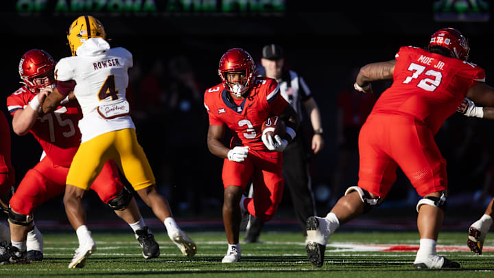 Nov 30, 2024; Tucson, Arizona, USA; Arizona Wildcats running back Kedrick Reescano (3) against the Arizona State Sun Devils in the second half during the Territorial Cup at Arizona Stadium. Mandatory Credit: Mark J. Rebilas-Imagn Images