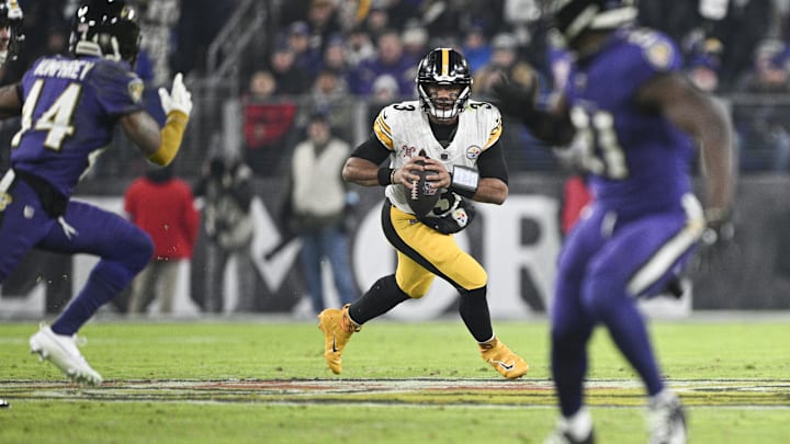 Dec 21, 2024; Baltimore, Maryland, USA;  Pittsburgh Steelers quarterback Russell Wilson (3) rolls pout top pass durn the first half against the Baltimore Ravens at M&T Bank Stadium. Mandatory Credit: Tommy Gilligan-Imagn Images