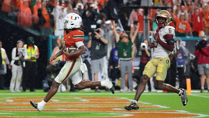 Oct 17, 2026; Miami Gardens, Florida, USA; Miami Hurricanes wide receiver Malachi Toney (1) scores a touchdown against Florida State Seminoles defensive back Ja'Bril Rawls (6) during the second quarter at Hard Rock Stadium. Mandatory Credit: Sam Navarro-Imagn Images Oct 17, 2026; Miami Gardens, Florida, USA; Miami Hurricanes wide receiver Malachi Toney (1) scores a touchdown against Florida State Seminoles defensive back Ja'Bril Rawls (6) during the second quarter at Hard Rock Stadium. Mandatory Credit: Sam Navarro-Imagn Images