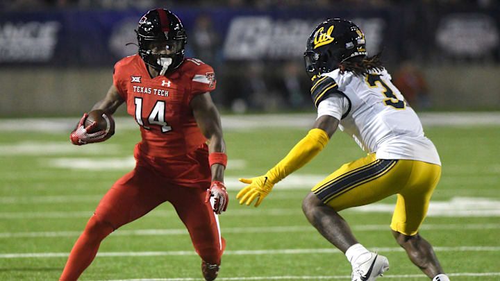 Texas Tech's wide receiver Xavier White (14) runs with the ball against California in the