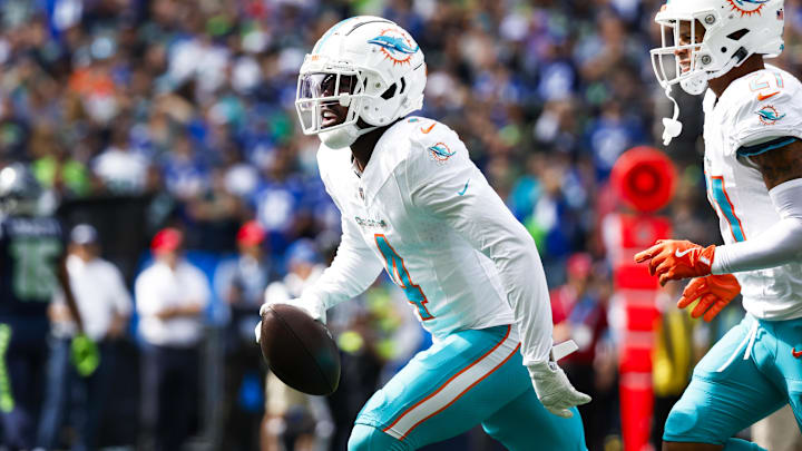 Miami Dolphins cornerback Kader Kohou (4) celebrates following an interception against the Seattle Seahawks during the first quarter at Lumen Field.