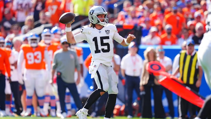 Oct 6, 2024; Denver, Colorado, USA; Las Vegas Raiders quarterback Gardner Minshew (15) prepares to pass in the second quarter against the Denver Broncos at Empower Field at Mile High. Mandatory Credit: Ron Chenoy-Imagn Images