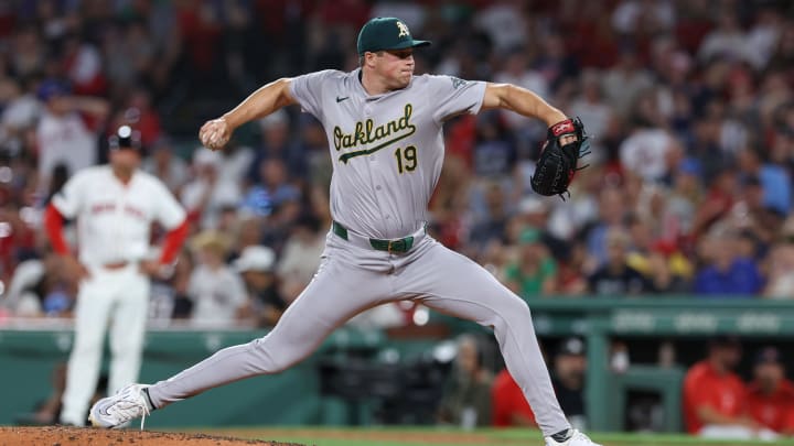 Jul 10, 2024; Boston, Massachusetts, USA; Oakland Athletics relief pitcher Mason Miller (19) delivers a pitch during the ninth inning against the Boston Red Sox at Fenway Park. 
