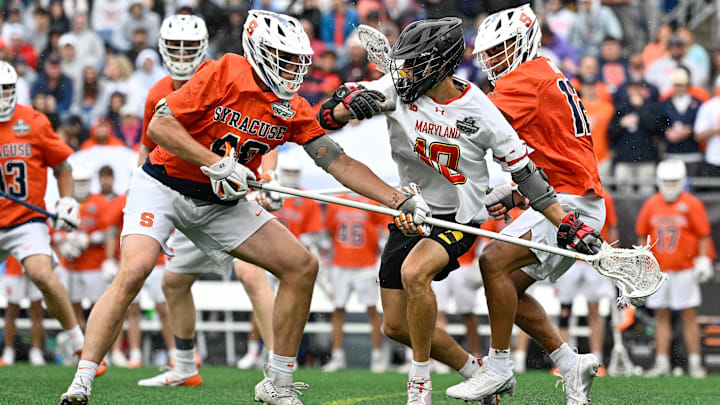 May 24, 2025; Foxborough, MA, USA; Syracuse long stick midfielder Michael Grace (48) stick checks Maryland attack Braden Erksa (10) during the NCAA D1 Men's Lacrosse National Championship Semifinal at Gillette Stadium.