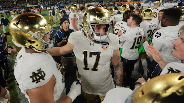 Jan 9, 2025; Miami, FL, USA; The Notre Dame Fighting Irish celebrate defeating the Penn State Nittany Lions  in the Orange Bowl at Hard Rock Stadium. Mandatory Credit: Sam Navarro-Imagn Images