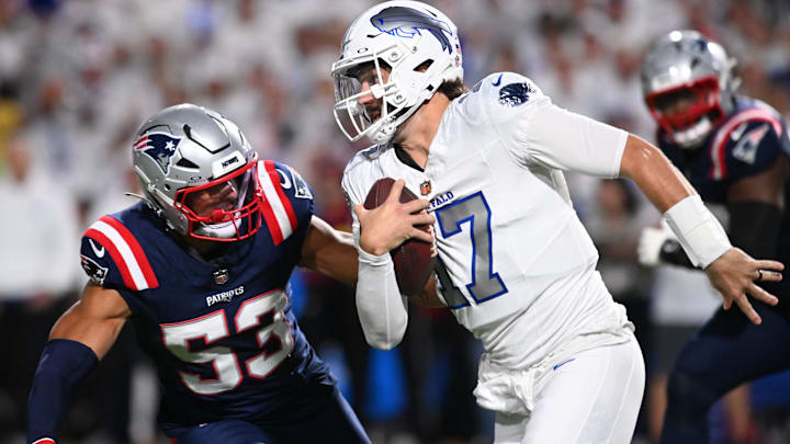 Buffalo Bills QB Josh Allen rushes the ball past New England Patriots linebacker Christian Elliss.