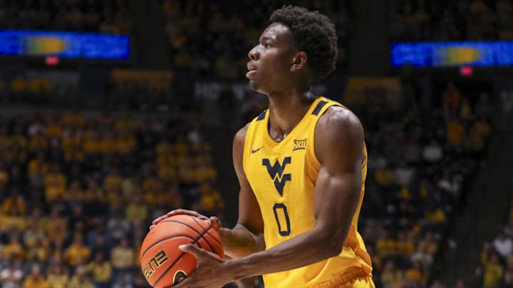 Jan 10, 2026; Morgantown, West Virginia, USA; West Virginia Mountaineers forward Brenen Lorient (0) shoots a three pointer during the second half against the Kansas Jayhawks at Hope Coliseum. Mandatory Credit: Ben Queen-Imagn Images