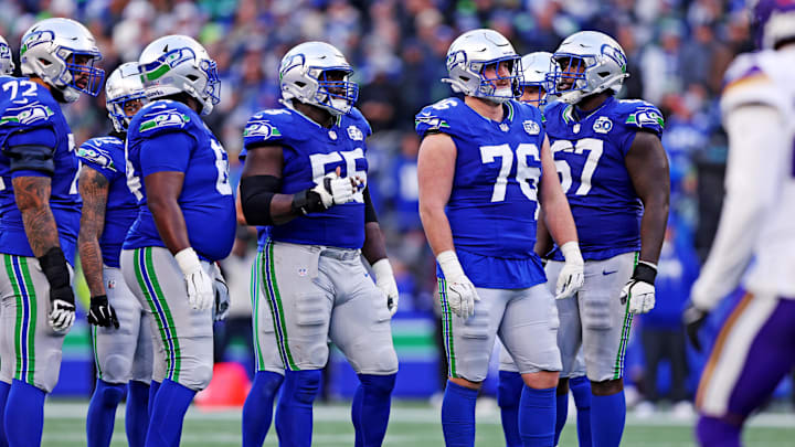 Nov 30, 2025; Seattle, Washington, USA; Seattle Seahawks guard Grey Zabel (76) reacts after an interception during the second half against the Minnesota Vikings at Lumen Field.
