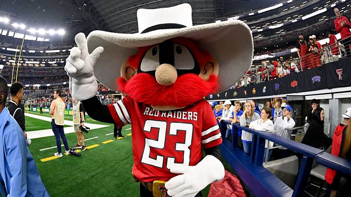 Dec 6, 2025; Arlington, TX, USA; The Texas Tech Red Raiders mascot poses for a photo during the game against the BYU Cougars during the first half at AT&T Stadium. Mandatory Credit: Jerome Miron-Imagn Images Dec 6, 2025; Arlington, TX, USA; The Texas Tech Red Raiders mascot poses for a photo during the game against the BYU Cougars during the first half at AT&T Stadium. Mandatory Credit: Jerome Miron-Imagn Images