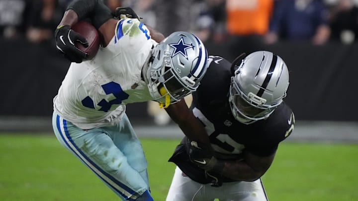 Las Vegas Raiders safety Lonnie Johnson Jr. (32) attempts to tackle Dallas Cowboys wide receiver George Pickens (3) during the second half at Allegiant Stadium last season.