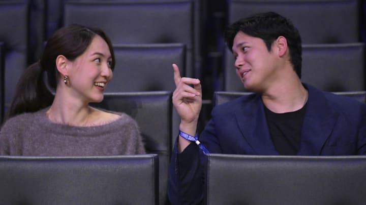 Dodgers star Shohei Ohtani and his wife Mamiko Tanaka attend a game between the Lakers and Trail Blazers at Crypto.com Arena on Dec. 8.