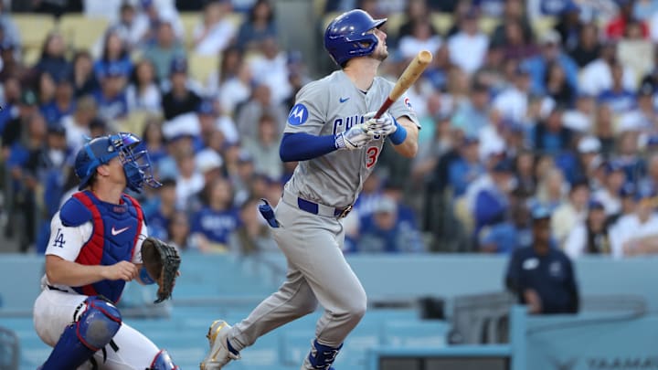 Apr 13, 2025; Los Angeles, California, USA; Chicago Cubs outfielder Kyle Tucker (30) hits a ground rule double against the Los Angeles Dodgers during the eighth inning of the game at Dodger Stadium. Mandatory Credit: Kiyoshi Mio-Imagn Images