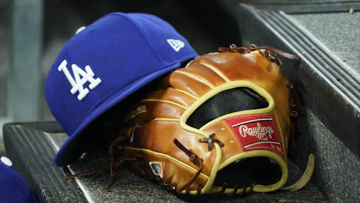 A hat and glove of an Los Angeles Dodgers player durng a game against the Toronto Blue Jays at Rogers Centre on April 28, 2024.