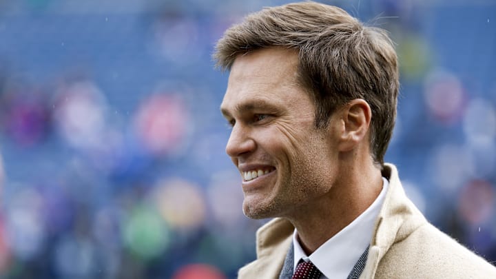 FOX commentator Tom Brady stands on the sideline before a game between the Seattle Seahawks and Buffalo Bills at Lumen Field.