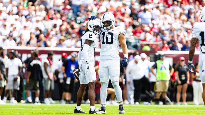 Penn State Nittany Lions cornerback Audavion Collins (2) celebrates a play with linebacker Caleb Bacon (10) during the game vs. the Temple Owls at Lincoln Financial Field. 