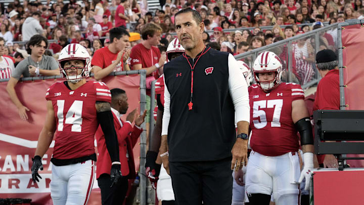 Aug 28, 2025; Madison, Wisconsin, USA;  Wisconsin Badgers head coach Luke Fickell walks onto the field for warmups prior to the game against the Miami (OH) RedHawks at Camp Randall Stadium. Mandatory Credit: Jeff Hanisch-Imagn Images
