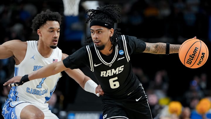 Mar 19, 2026; Greenville, SC, USA; VCU Rams guard Terrence Hill Jr. (6) dribbles the ball against North Carolina Tar Heels guard Seth Trimble (7) in the first half of a first round game of the men's 2026 NCAA Tournament at Bon Secours Wellness Arena. Mandatory Credit: Bob Donnan-Imagn Images Mar 19, 2026; Greenville, SC, USA; VCU Rams guard Terrence Hill Jr. (6) dribbles the ball against North Carolina Tar Heels guard Seth Trimble (7) in the first half of a first round game of the men's 2026 NCAA Tournament at Bon Secours Wellness Arena. Mandatory Credit: Bob Donnan-Imagn Images