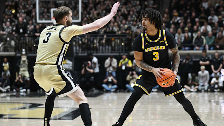Feb 17, 2026; West Lafayette, Indiana, USA; Michigan Wolverines guard Elliot Cadeau (3) controls the ball as Purdue Boilermakers guard Braden Smith (3) defends during the first half at Mackey Arena. Mandatory Credit: Marc Lebryk-Imagn Images Feb 17, 2026; West Lafayette, Indiana, USA; Michigan Wolverines guard Elliot Cadeau (3) controls the ball as Purdue Boilermakers guard Braden Smith (3) defends during the first half at Mackey Arena. Mandatory Credit: Marc Lebryk-Imagn Images