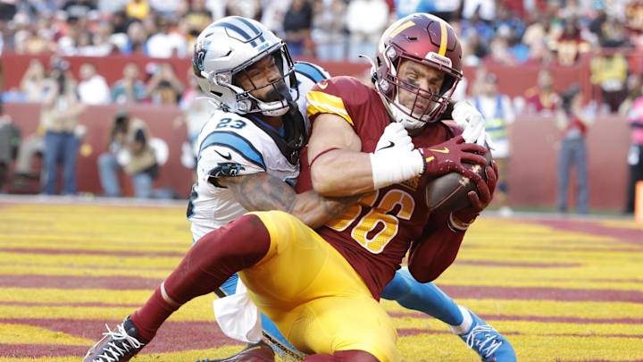 Oct 20, 2024; Landover, Maryland, USA; Washington Commanders tight end Zach Ertz (86) catches a touchdown pass as Carolina Panthers cornerback Dane Jackson (23) defends during the second quarter at Northwest Stadium. Mandatory Credit: Amber Searls-Imagn Images