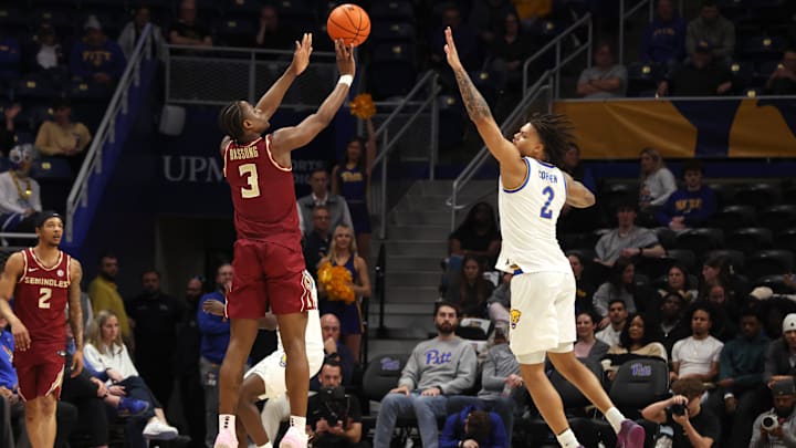 Mar 4, 2026; Pittsburgh, Pennsylvania, USA; Florida State Seminoles guard Thomas Bassong (3) shoots a three point basket against Pittsburgh Panthers forward Cameron Corhen (2) during the first half at the Petersen Events Center. Mandatory Credit: Charles LeClaire-Imagn Images Mar 4, 2026; Pittsburgh, Pennsylvania, USA; Florida State Seminoles guard Thomas Bassong (3) shoots a three point basket against Pittsburgh Panthers forward Cameron Corhen (2) during the first half at the Petersen Events Center. Mandatory Credit: Charles LeClaire-Imagn Images