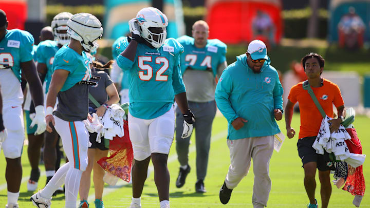 Miami Dolphins offensive tackle Patrick Paul (52) walks on the field during joint practice with the Washington Commanders at Baptist Health Training Complex.