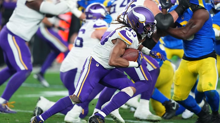 Jan 13, 2025; Glendale, AZ, USA; Minnesota Vikings running back Aaron Jones (33) rushes the ball against the Los Angeles Rams during the second half in an NFC wild card game at State Farm Stadium. Mandatory Credit: Joe Camporeale-Imagn Images Jan 13, 2025; Glendale, AZ, USA; Minnesota Vikings running back Aaron Jones (33) rushes the ball against the Los Angeles Rams during the second half in an NFC wild card game at State Farm Stadium. Mandatory Credit: Joe Camporeale-Imagn Images