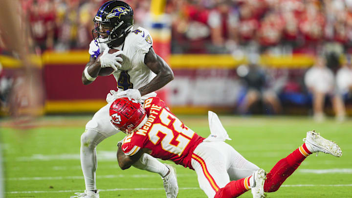 Sep 5, 2024; Kansas City, Missouri, USA; Baltimore Ravens wide receiver Zay Flowers (4) is tackled by Kansas City Chiefs cornerback Trent McDuffie (22) at GEHA Field at Arrowhead Stadium. Mandatory Credit: Jay Biggerstaff-Imagn Images