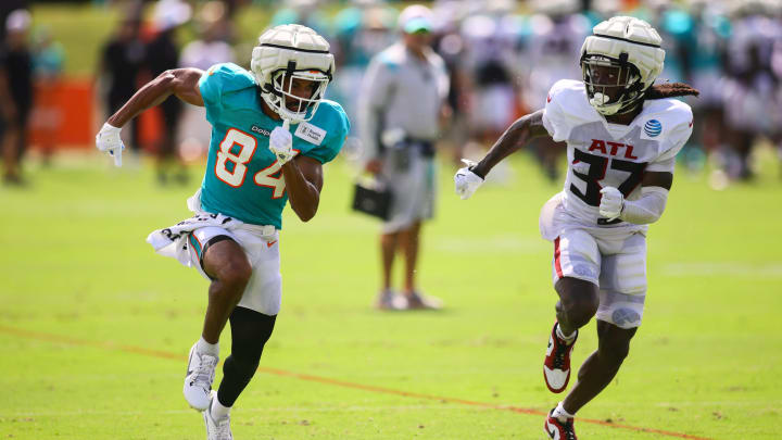 Aug 6, 2024; Miami Gardens, FL, USA; Miami Dolphins wide receiver Anthony Schwartz (84) runs against Atlanta Falcons cornerback Harrison Hand (37) during a joint practice at Baptist Health Training Complex. Aug 6, 2024; Miami Gardens, FL, USA; Miami Dolphins wide receiver Anthony Schwartz (84) runs against Atlanta Falcons cornerback Harrison Hand (37) during a joint practice at Baptist Health Training Complex.