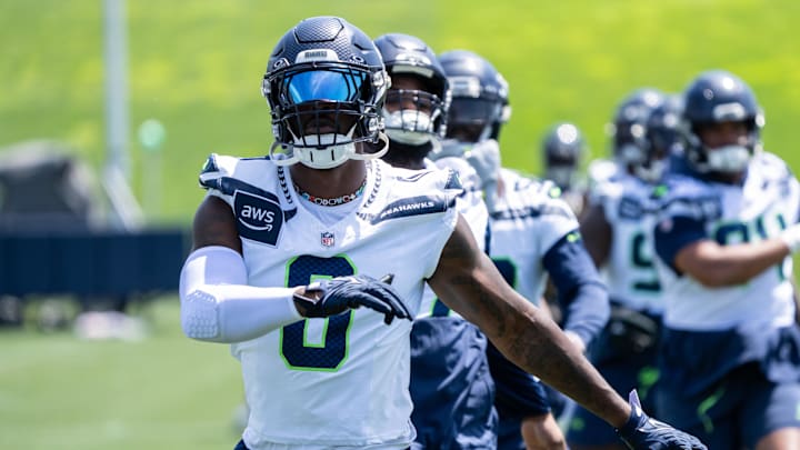 Jun 11, 2025; Renton, WA, USA; Seattle Seahawks defensive end DeMarcus Lawrence (0) takes part in drills during mini-camp at Virginia Mason Athletic Center. Mandatory Credit: Stephen Brashear-Imagn Images