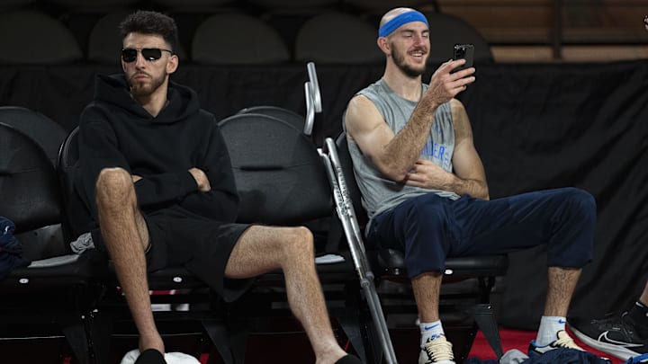 December 13, 2024; Las Vegas, Nevada, USA; Oklahoma City Thunder forward Chet Holmgren (left) and guard Alex Caruso (right) sit during practice prior to the Emirates NBA Cup semi-finals at T-Mobile Arena. Mandatory Credit: Kyle Terada-Imagn Images