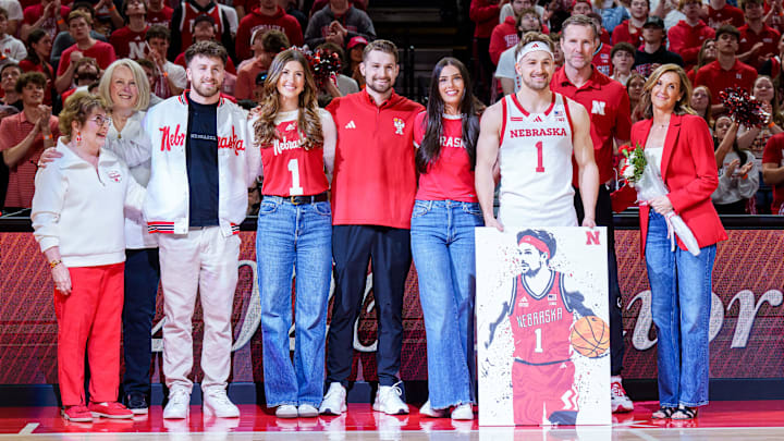Mar 8, 2026; Lincoln, Nebraska, USA; Nebraska Cornhuskers guard Sam Hoiberg (1) poses with family during the senior day ceremony before the game against the Iowa Hawkeyes at Pinnacle Bank Arena. Mandatory Credit: Dylan Widger-Imagn Images