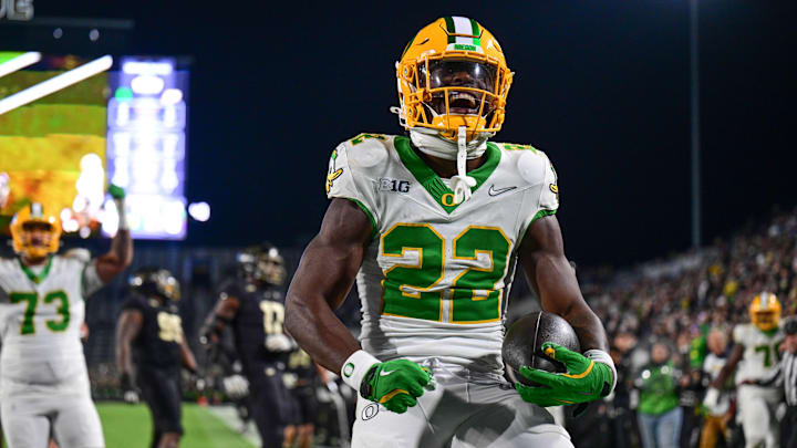 Oct 18, 2024; West Lafayette, Indiana, USA; Oregon Ducks running back Jay Harris (22) celebrates scoring a touchdown during the second half against the Purdue Boilermakers at Ross-Ade Stadium. Mandatory Credit: Marc Lebryk-Imagn Images