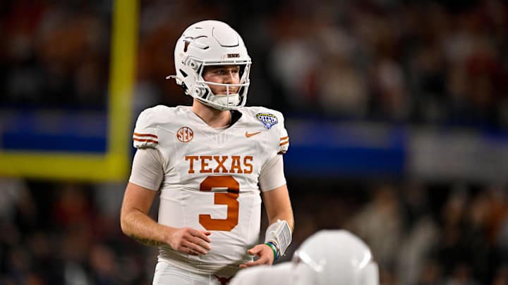 Jan 10, 2025; Arlington, TX, USA; Texas Longhorns quarterback Quinn Ewers (3) in action during the game between the Texas Longhorns and the Ohio State Buckeyes at AT&T Stadium. Mandatory Credit: Jerome Miron-Imagn Images