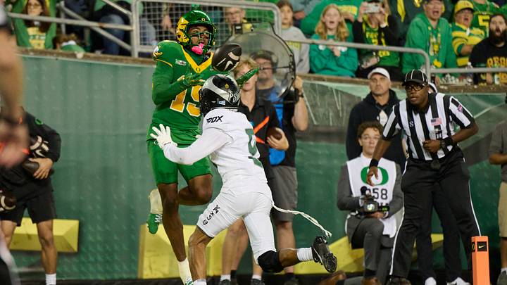 Sep 18, 2026; Eugene, Oregon, USA; Oregon Ducks wide receiver Messiah Hampton (15) catches a touchdown pass during the first half against Portland State Vikings cornerback Marcellous Ryan (5) at Autzen Stadium. Mandatory Credit: Troy Wayrynen-Imagn Images