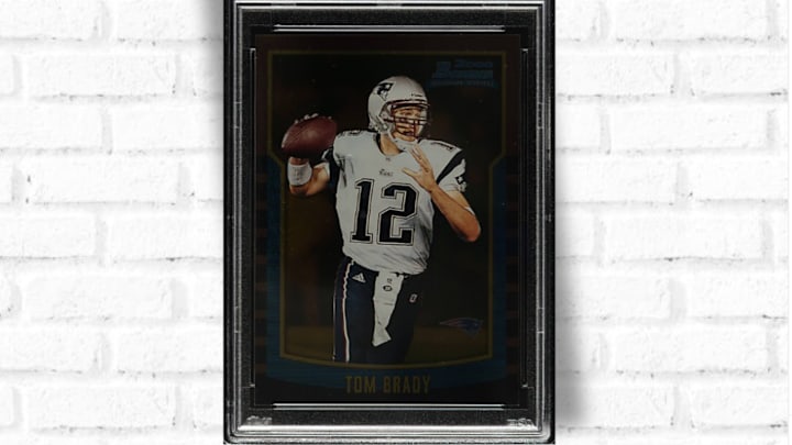 A PSA 10 example of Tom Brady’s 2000 Bowman Gold rookie card set a new record this month.