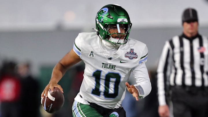 Dec 6, 2024; West Point, NY, USA; Tulane Green Wave quarterback Darian Mensah (10) runs with the ball against the Army Black Knights during the first half at Michie Stadium.