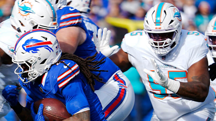 Miami Dolphins DT Benito Jones (95) chases Buffalo Bills running back James Cook at Highmark Stadium in Week 9 of the 2024 season.