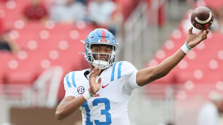 Nov 2, 2024; Fayetteville, Arkansas, USA; Ole Miss Rebels quarterback Austin Simmons (13) during the fourth quarter against the Arkansas Razorbacks at Donald W. Reynolds Razorback Stadium. Mississippi won 63-31. Mandatory Credit: Nelson Chenault-Imagn Images