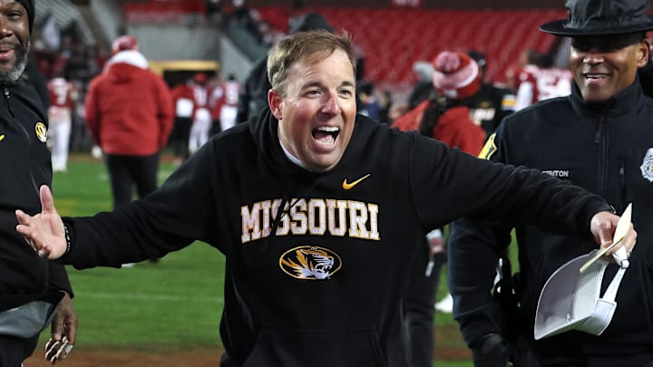 Nov 29, 2025; Fayetteville, Arkansas, USA; Missouri Tigers head coach Eli Drinkwitz celebrates after a game against the Arkansas Razorbacks at Donald W. Reynolds Razorback Stadium. Missouri won 31-17. Mandatory Credit: Nelson Chenault-Imagn Images