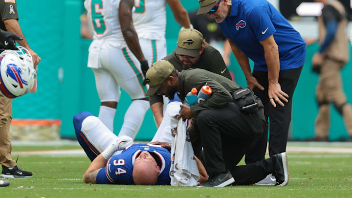 Nov 9, 2025; Miami Gardens, Florida, USA; Buffalo Bills defensive end Landon Jackson (94) is tended to by trainers during the first half against the Miami Dolphins at Hard Rock Stadium.