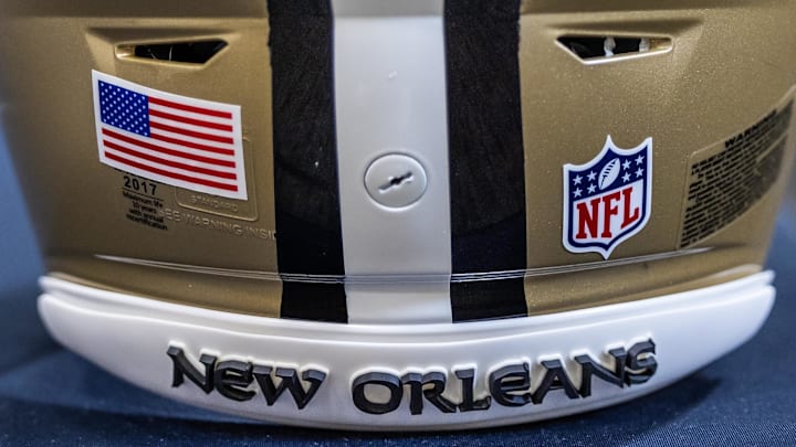 Mar 11, 2023; Metairie, LA, USA; Detailed view of New Orleans Saints helmet at Ochsner Sports Performance Center. Mandatory Credit: Stephen Lew-Imagn Images Mar 11, 2023; Metairie, LA, USA; Detailed view of New Orleans Saints helmet at Ochsner Sports Performance Center. Mandatory Credit: Stephen Lew-Imagn Images