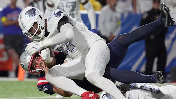 Buffalo Bills defensive end A.J. Epenesa tackles New England Patriots quarterback Drake Maye during first half action at Highmark Stadium in Orchard Park on Oct. 5, 2025.