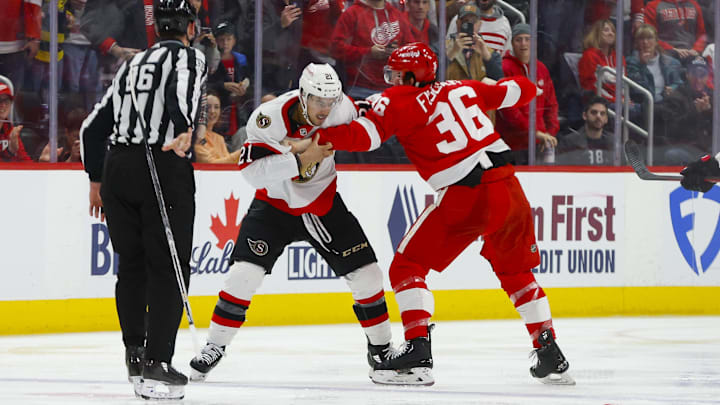 Ottawa Senators right wing Mathieu Joseph (21) scuffles with Detroit Red Wings forward Christian Fischer (36). 