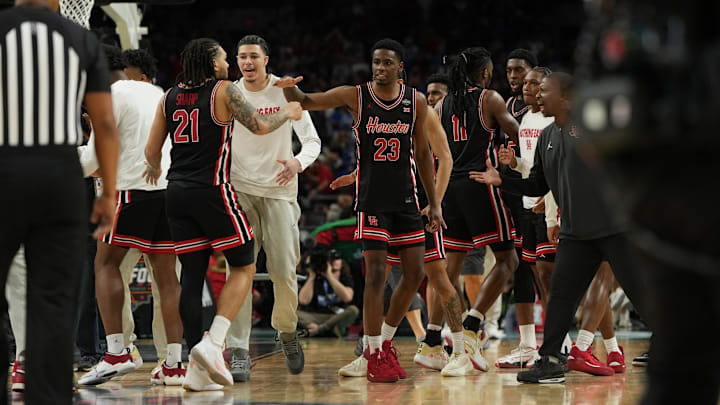 Houston players Emanuel Sharp (21) and Terrance Arceneaux (23) congratulate one another after the Cougars' Final Four win against Duke on April 5, 2025.
