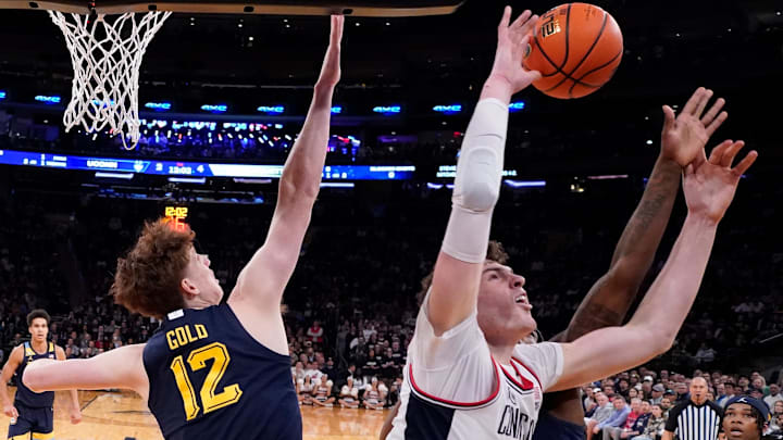 Mar 16, 2024; New York City, NY, USA;  Marquette Golden Eagles defense stops Connecticut Huskies