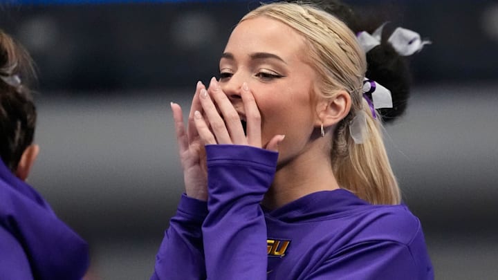LSU gymnast Livvy Dunne stretches with teammates before Session 2 of the SEC Gymnastics Tournament at Legacy Arena in Birmingham, Alabama.