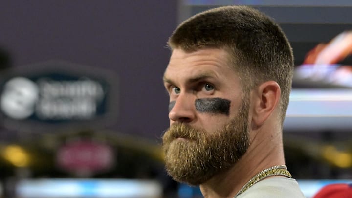 Sept. 16, 2025; Los Angeles, California, USA;  Philadelphia Phillies first baseman Bryce Harper (3) looks on from the dugout against the Los Angeles Dodgers at Dodger Stadium.