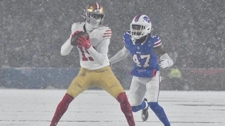 Dec 1, 2024; Orchard Park, New York, USA; San Francisco 49ers wide receiver Jauan Jennings (15) tries to avoid a tackle by Buffalo Bills cornerback Christian Benford (47) after making a catch in the third quarter at Highmark Stadium. Mandatory Credit: Mark Konezny-Imagn Images Dec 1, 2024; Orchard Park, New York, USA; San Francisco 49ers wide receiver Jauan Jennings (15) tries to avoid a tackle by Buffalo Bills cornerback Christian Benford (47) after making a catch in the third quarter at Highmark Stadium. Mandatory Credit: Mark Konezny-Imagn Images