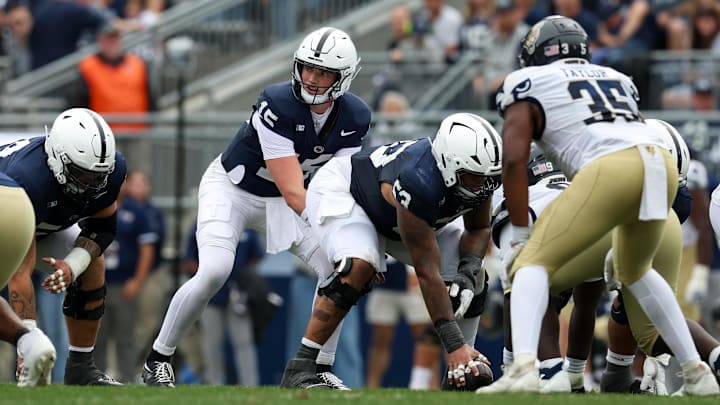 Penn State Nittany Lions quarterback Drew Allar (15) lines up behind center Nick Dawkins (53) vs. the FIU Panthers at Beaver Stadium. 