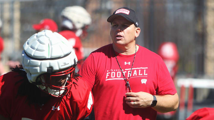 Wisconsin offensive line coach AJ Blazek works with Manny Mullens (58) during spring practice outside Camp Randall Stadium in Madison, Wisconsin on Saturday April 13, 2024